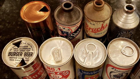 When and why did breweries stop using pop-top cans?